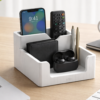 White minimalist desk organizer holding a smartphone and wallet on a clean office table