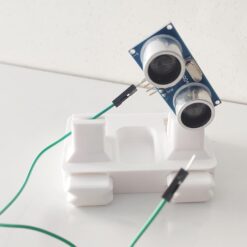 Close up of Anant PCB jig holding a green circuit board for precision soldering