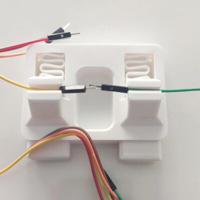 Anant clamp jig holding two wires together for tinning and soldering repair