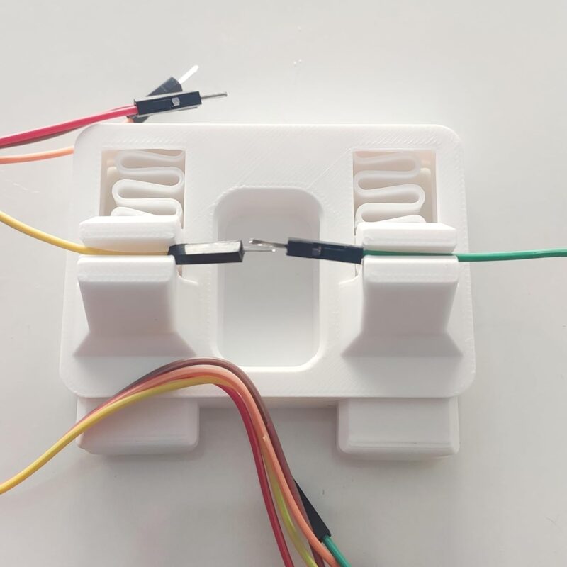 Anant clamp jig holding two wires together for tinning and soldering repair